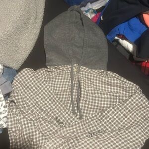 Cropped button up flannel has holes in the arm made like that with a hood